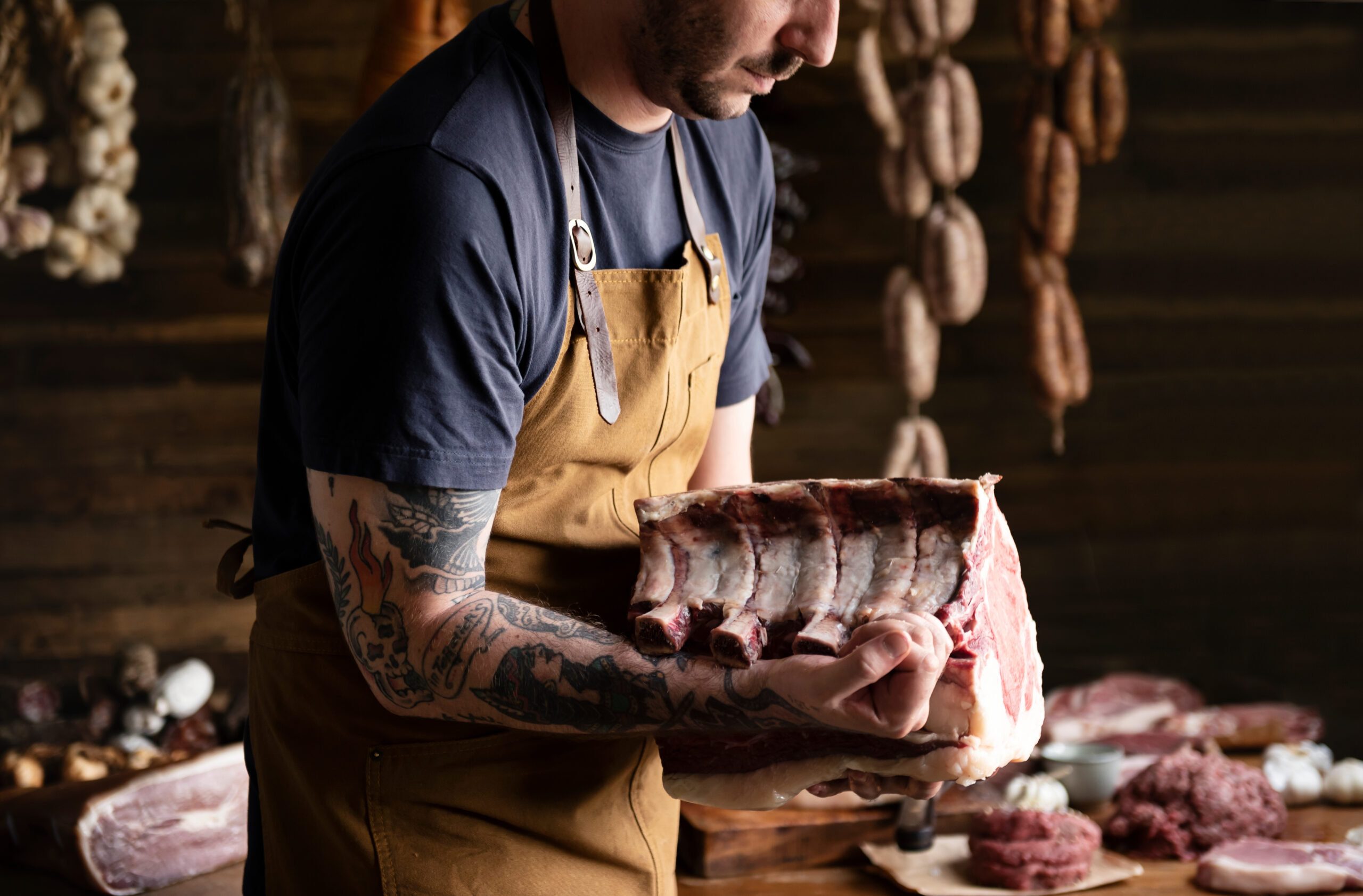 Butcher selling meat in a butcher shop food photography recipe idea