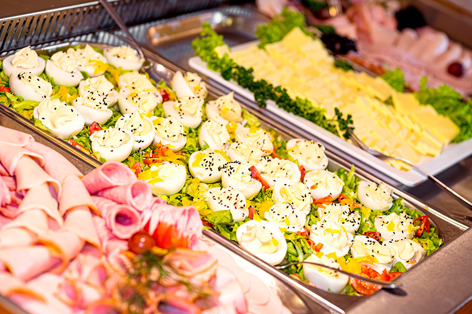 Swedish buffet at the party. Trays with cold snacks, cold cuts,