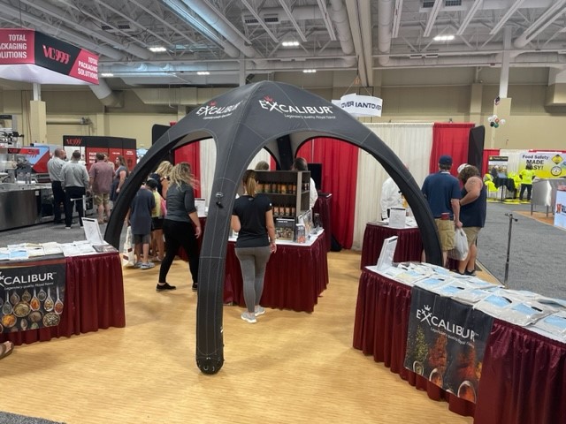 Excalibur Seasonings team at a booth during a trade show